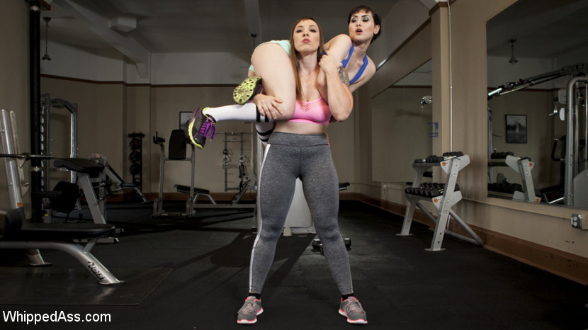 Going the Extra Mile: Strict Trainer Dominates Lesbian Gym Slut