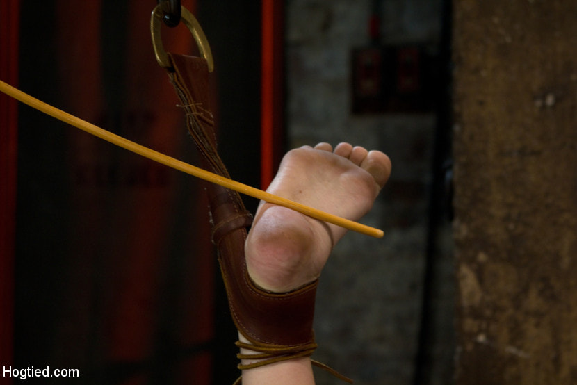 Blond with killer natural body, is suspended, suffers intense foot caning Made to cum over and over