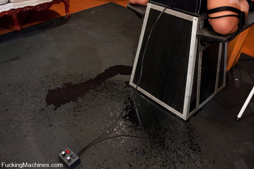 Isis Love bound to the Sybian, squirting puddles