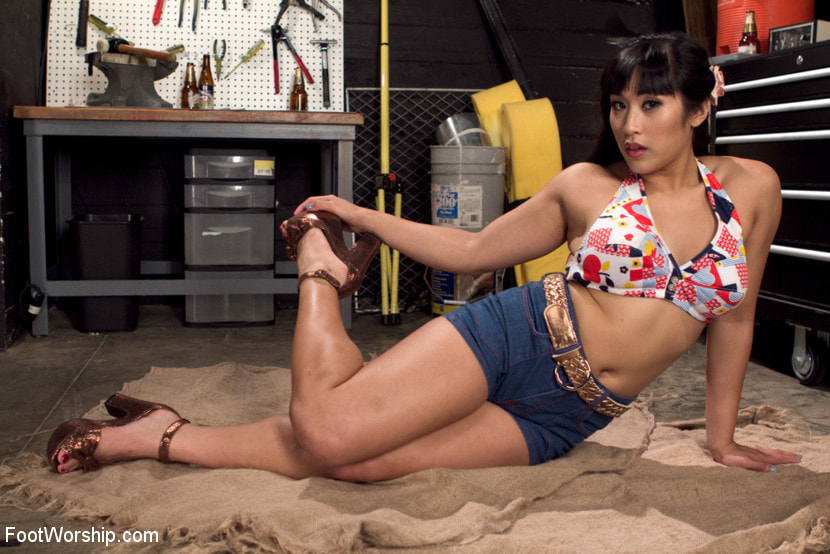 Mia Li Sneaks Into the Garage to Give a Foot Job