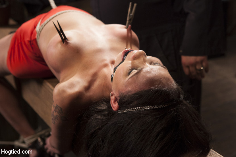 Big tit Brunette caught in brutal bondage.